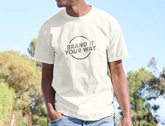 Person standing outdoors wearing a t-shirt with custom logo.