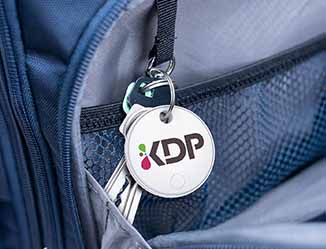 Custom printed two way locator button attached to keys.